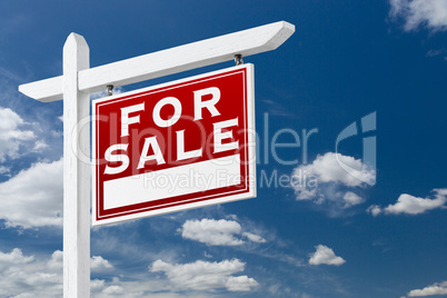 Right Facing For Sale Real Estate Sign Over Blue Sky and Clouds