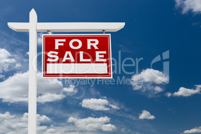 Right Facing For Sale Real Estate Sign Over Blue Sky and Clouds