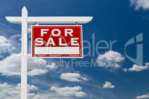 Right Facing For Sale Real Estate Sign Over Blue Sky and Clouds
