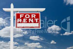 Right Facing For Rent Real Estate Sign Over Blue Sky and Clouds
