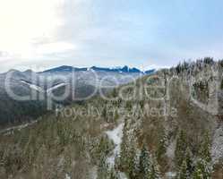 Beginning of Winter in the Mountains. Aerial View