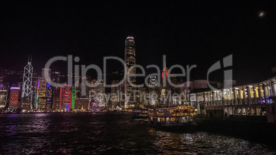 Hong Kong cityscape, building and ferry boat near victoria river