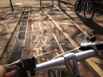 head of bike, bicycle lane with word END on floor