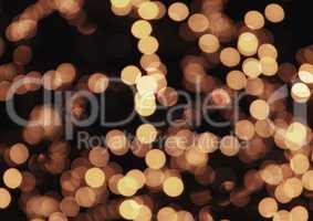 Golden bokeh glittering bright abstract background