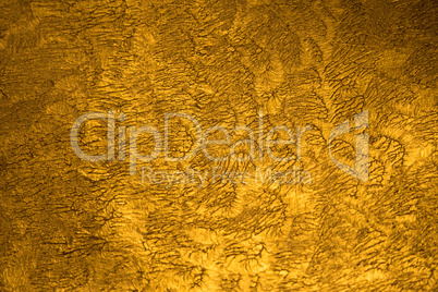 Golden metallic shinny textured background with detail pattern