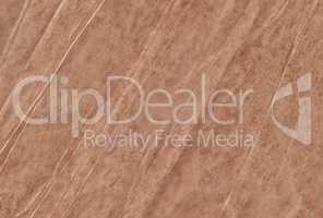Brown blank crumpled and grungy textured paper background