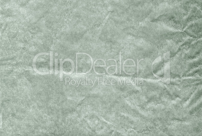 Green blank crumpled and grungy textured paper background