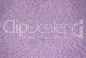Purple blank crumpled and grungy textured paper background