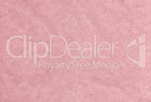 Pink blank crumpled and grungy textured paper background