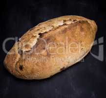 loaf of white wheat flour on a black surface
