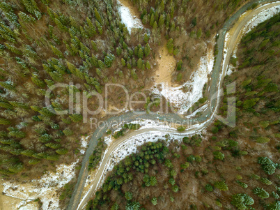 River and Snow in the Spruce Forest. Aerial View
