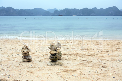 Balancing Stones On Beach