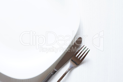 Empty Plate Near Fork And Knife