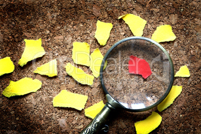 Magnifying Glass And Paper Scraps