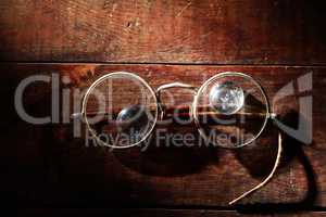 Old Spectacles On Wood