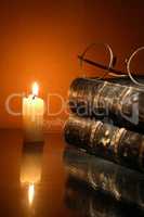 Lighting Candle Near Book