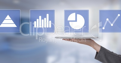 Hand holding tablet with business chart statistic icons