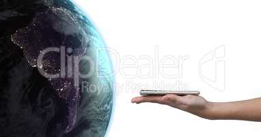 Hand holding tablet with global world