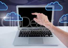 Hand using laptop with cloud icons