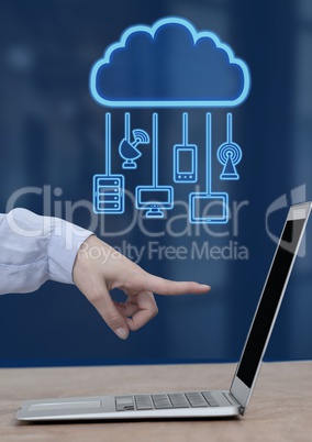 Hand pointing at laptop with cloud icon and hanging connection devices
