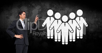 Businessman pointing at people group icons