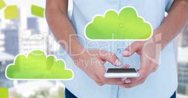 Hand holding phone with cloud icons