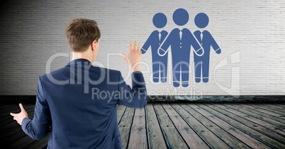 Business people group on wall with businessman Business people group on wall with businessman