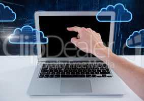 Hand using laptop with cloud icons and technology background