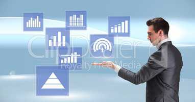 Businessman interacting with business chart statistic icons