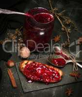 toast with raspberry jam and empty jam jar