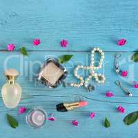 Set of decorative cosmetics on wooden table. Flat lay, top view.