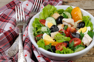 Vegetable salad with chicken and eggs
