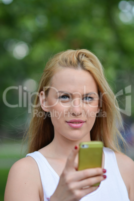Young blonde girl with smart phone