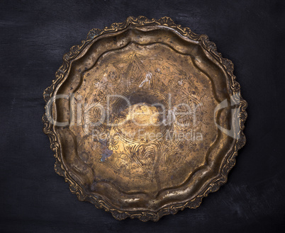 empty round copper plate with monograms