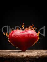 A burning heart on dark background