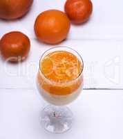 Panna cota  with tangerines in a glass beaker