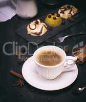 white ceramic cup of black coffee