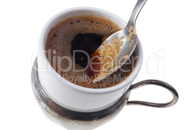 Close up of adding brown sugar in traditional Turkish coffee