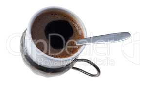 Cup of traditional homemade Turkish coffee on white background