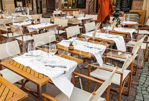 Empty outdoor restaurant with table set
