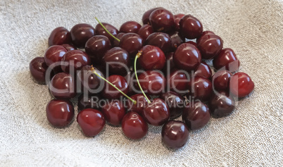 Ripe cherries on the table on a napkin.