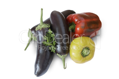 A variety of vegetables and parsley on a white background.