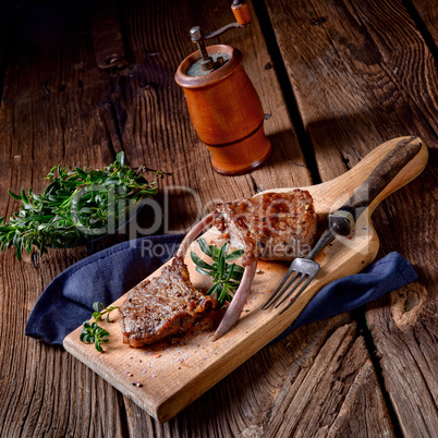 Grilled lamb chops an old board