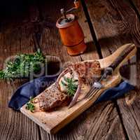 Grilled lamb chops an old board