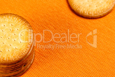 Homemade cookies on orange cloth.