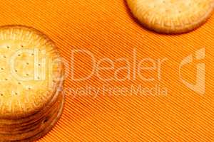 Homemade cookies on orange cloth.