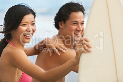 Asian Man Woman Couple Surfboards Surfing on Beach