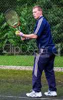 Male playing Tennis