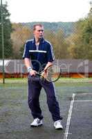 Male playing Tennis