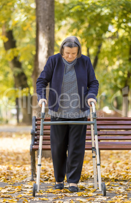Woman with walker walking outdoors